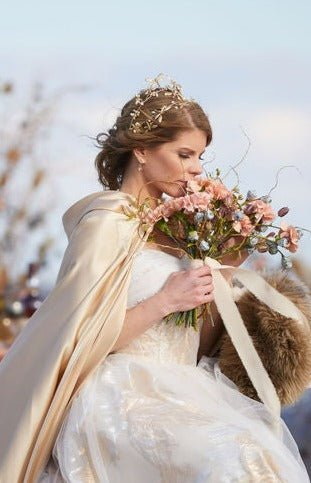 Majestic fairytale bride wearing a golden double-banded dragonfly hair crown with freshwater pearls. 