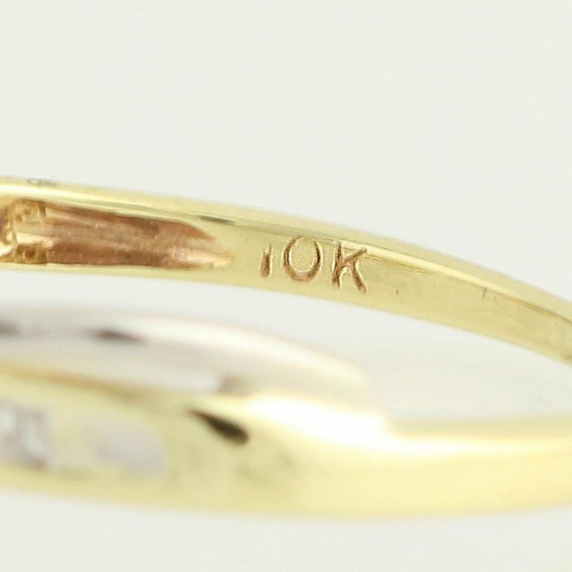 Extreme close up of the inside of the Swan vintage engagement ring showing 10k gold stamp. 