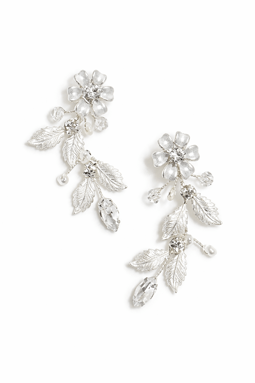 Silver leaf and freshwater pearl crystal wedding earrings on a white background